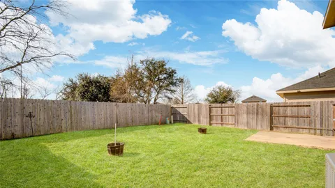 a backyard of a house with lots of green space