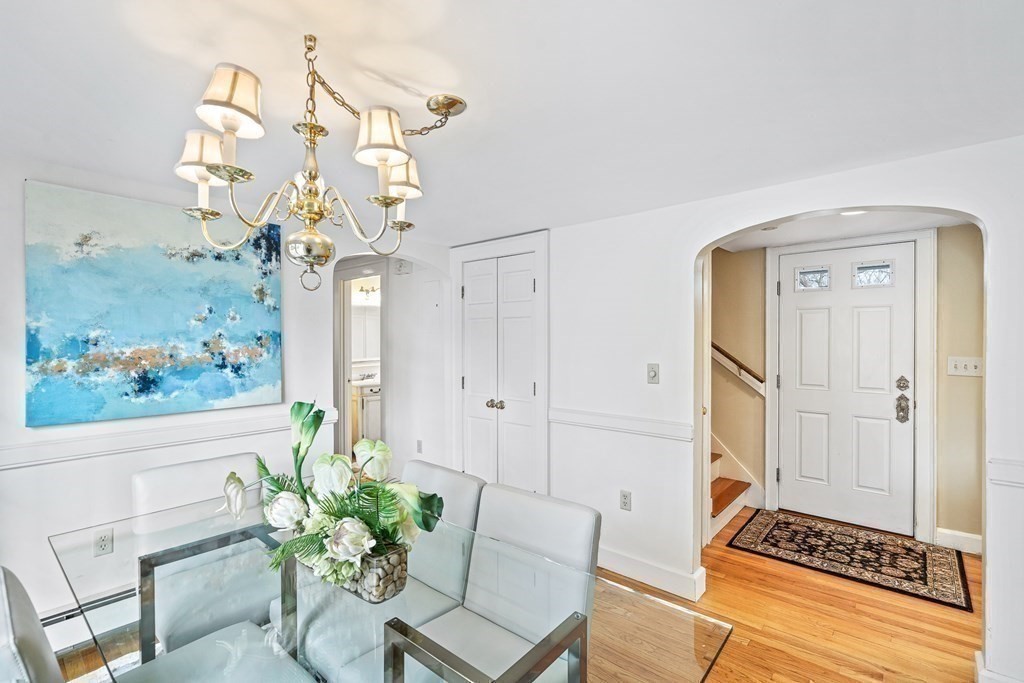 14 Fife Road Wellesley, MA 02481 - Photo 11 of 36 a dining room with furniture and a chandelier