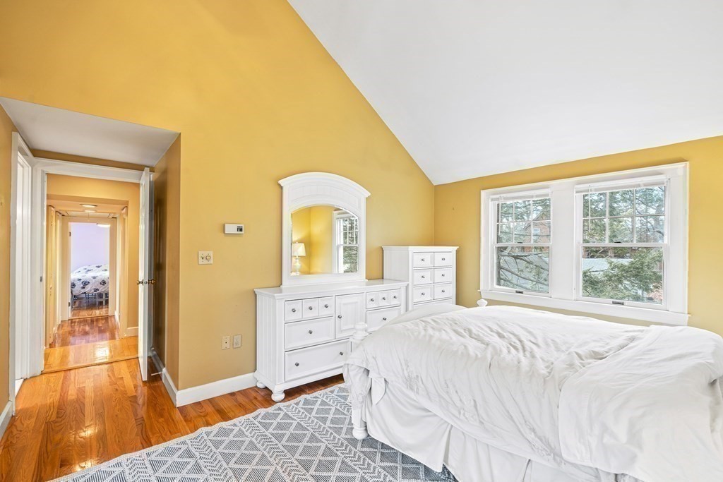 14 Fife Road Wellesley, MA 02481 - Photo 18 of 36 a spacious bedroom with a bed and a dresser next to a window