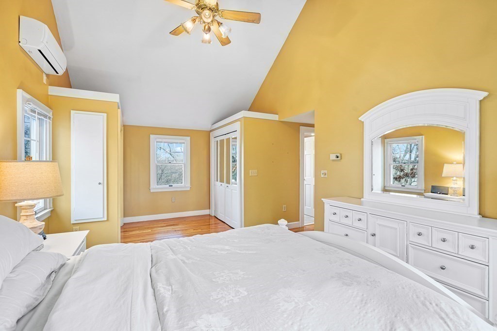 14 Fife Road Wellesley, MA 02481 - Photo 19 of 36 a bedroom with a bed and a chandelier