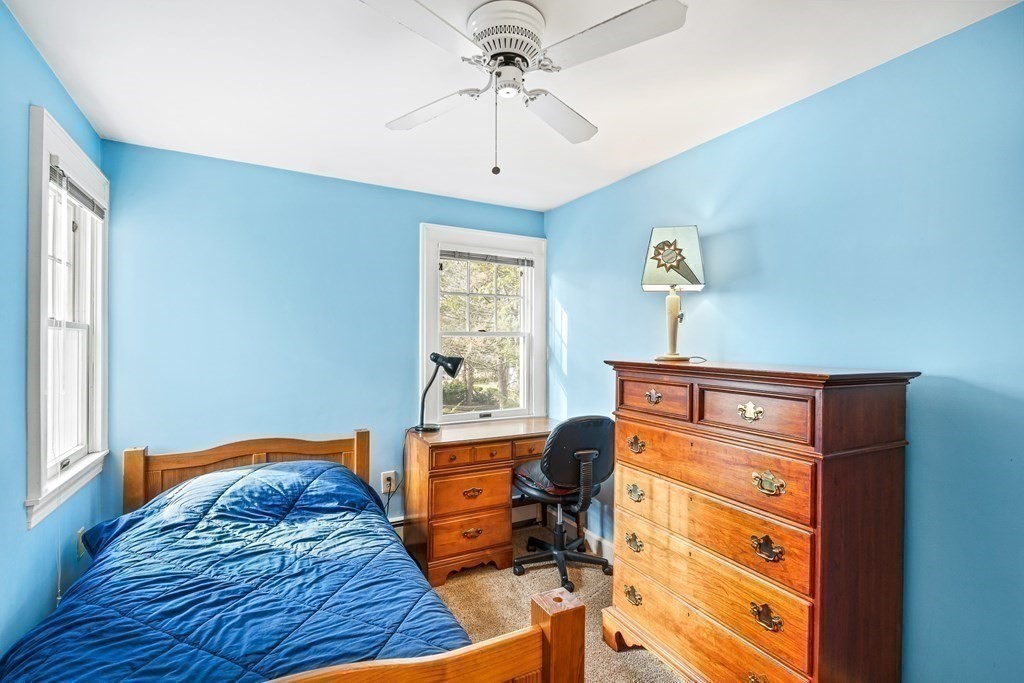 14 Fife Road Wellesley, MA 02481 - Photo 23 of 36 a bedroom with a bed and a chandelier