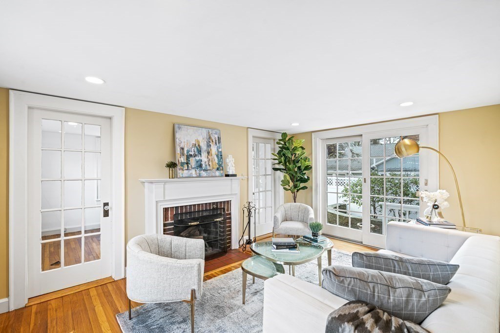 14 Fife Road Wellesley, MA 02481 - Photo 29 of 36 a living room with furniture a fireplace and a large window