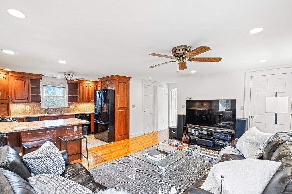 14 Fife Road Wellesley, MA 02481 - Photo 6 of 36 a living room with furniture and a flat screen tv with kitchen view
