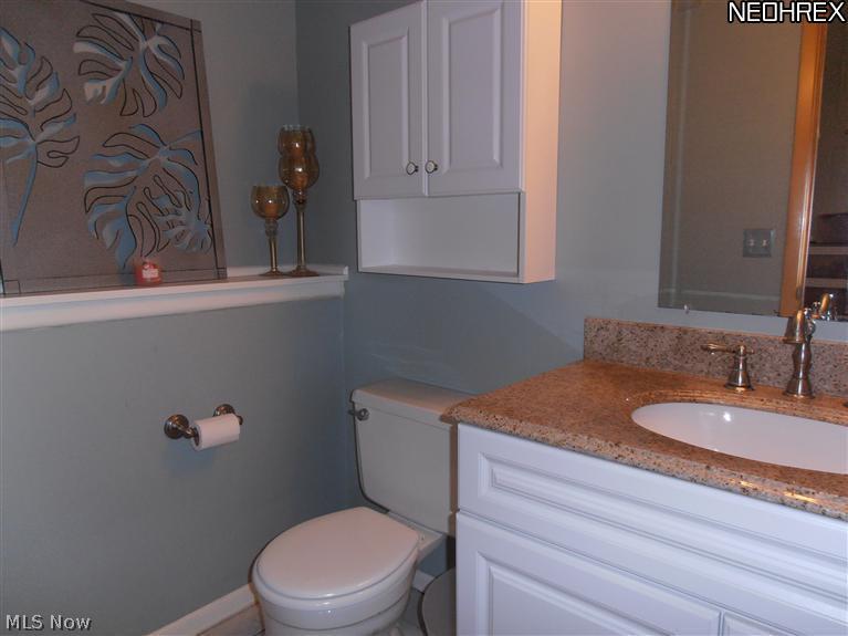 995 Millridge Road Cleveland, OH 44143 - Photo 8 of 17 Half Bath has been totally remodeled with granite top on vanity