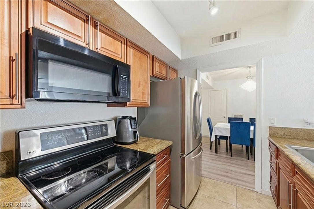 2838 Geary Place, Unit 4017 Las Vegas, NV 89109 - Photo 12 of 31 You’ll find a stainless steel refrigerator with ice maker in the kitchen, plus a Whirlpool washer and dryer to make daily routines easier.