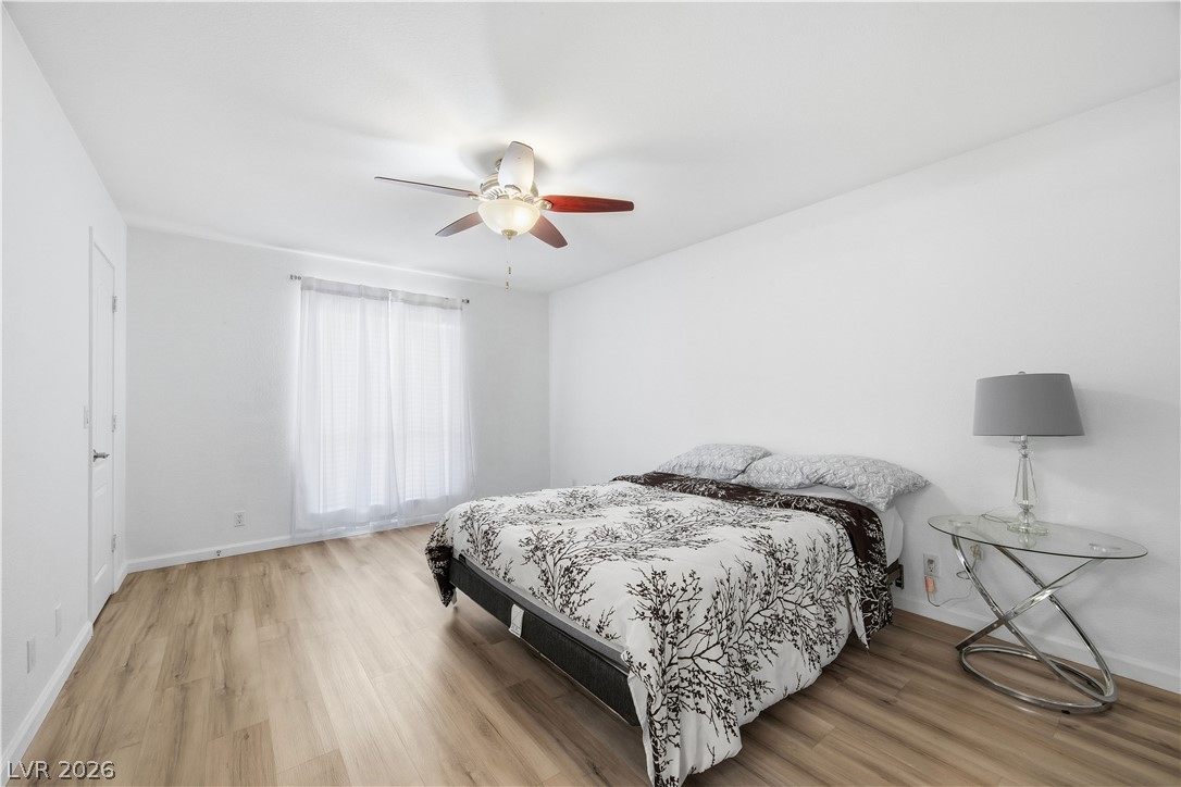2838 Geary Place, Unit 4017 Las Vegas, NV 89109 - Photo 14 of 31 The primary suite includes flexible space and a built-in vanity, complemented by two closets, luxury plank floors, and large windows that bring in beautiful natural light.