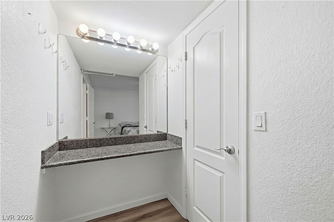 2838 Geary Place, Unit 4017 Las Vegas, NV 89109 - Photo 16 of 31 The primary suite provides flexible space with a built-in vanity, giving you room for getting ready or creating a personal office corner.