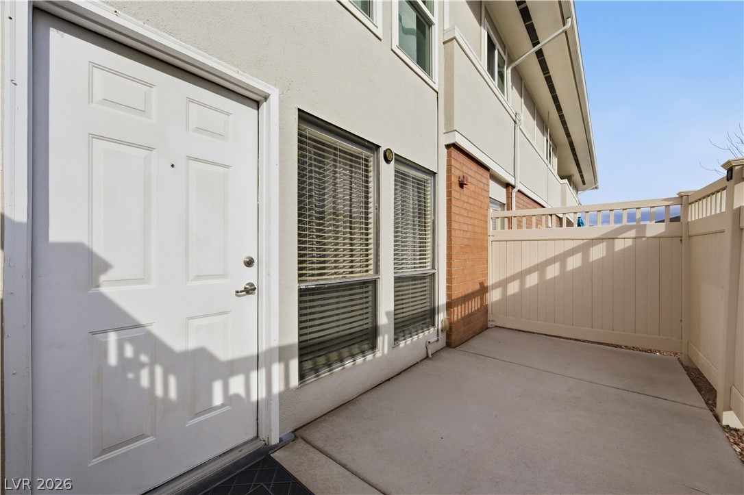 2838 Geary Place, Unit 4017 Las Vegas, NV 89109 - Photo 2 of 31 Enjoy the comfort of a fenced patio entry that adds an extra layer of privacy and security within this guard-gated neighborhood.