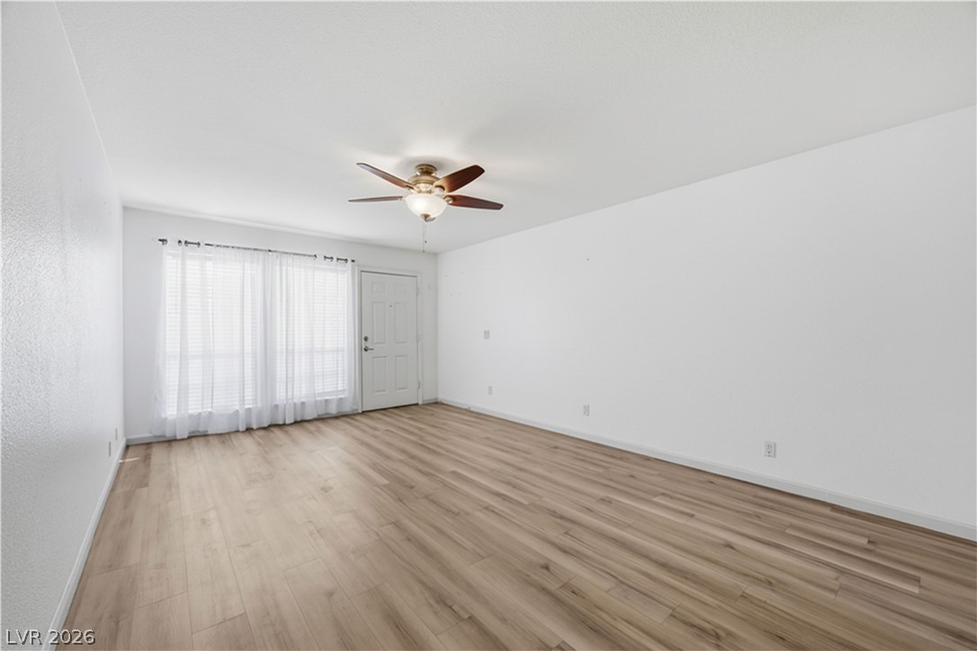 2838 Geary Place, Unit 4017 Las Vegas, NV 89109 - Photo 5 of 31 The generous windows bring in beautiful natural light, creating a comfortable atmosphere in the living room.