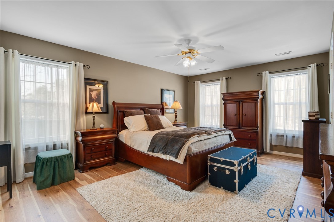 13366 Depot Road Hanover, VA 23069 - Photo 15 of 27 a bedroom with a bed and wooden floor