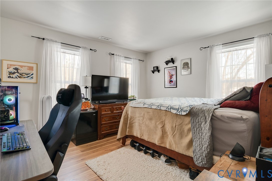 13366 Depot Road Hanover, VA 23069 - Photo 19 of 27 a bedroom with a bed and a flat screen tv