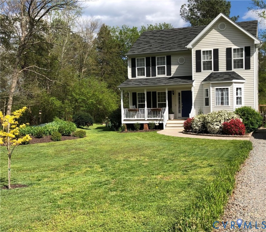 13366 Depot Road Hanover, VA 23069 - Photo 4 of 27 a front view of a house with a yard