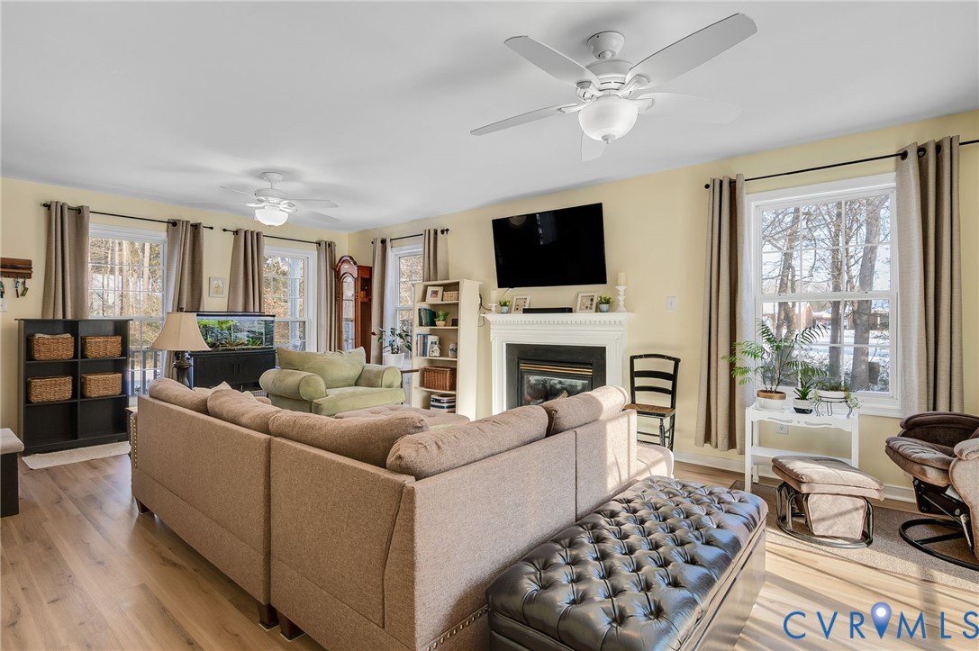 13366 Depot Road Hanover, VA 23069 - Photo 7 of 27 a living room with furniture a flat screen tv and a fireplace