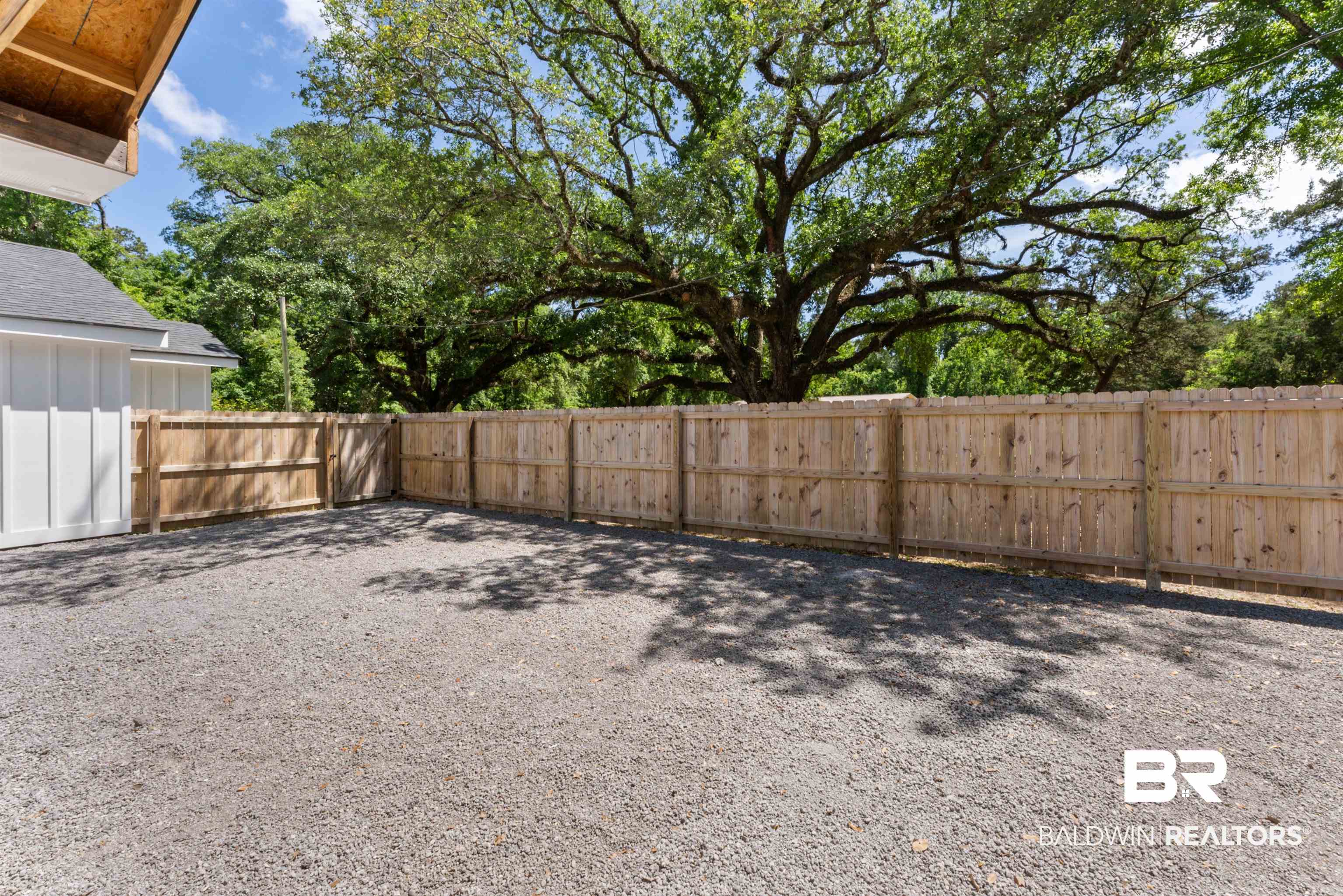6447 Bemis Lane Bon Secour, AL 36511 - Photo 58 of 62 Gravel yard with a new wood privacy fence