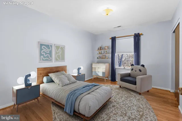 a bedroom with a bed and a couch