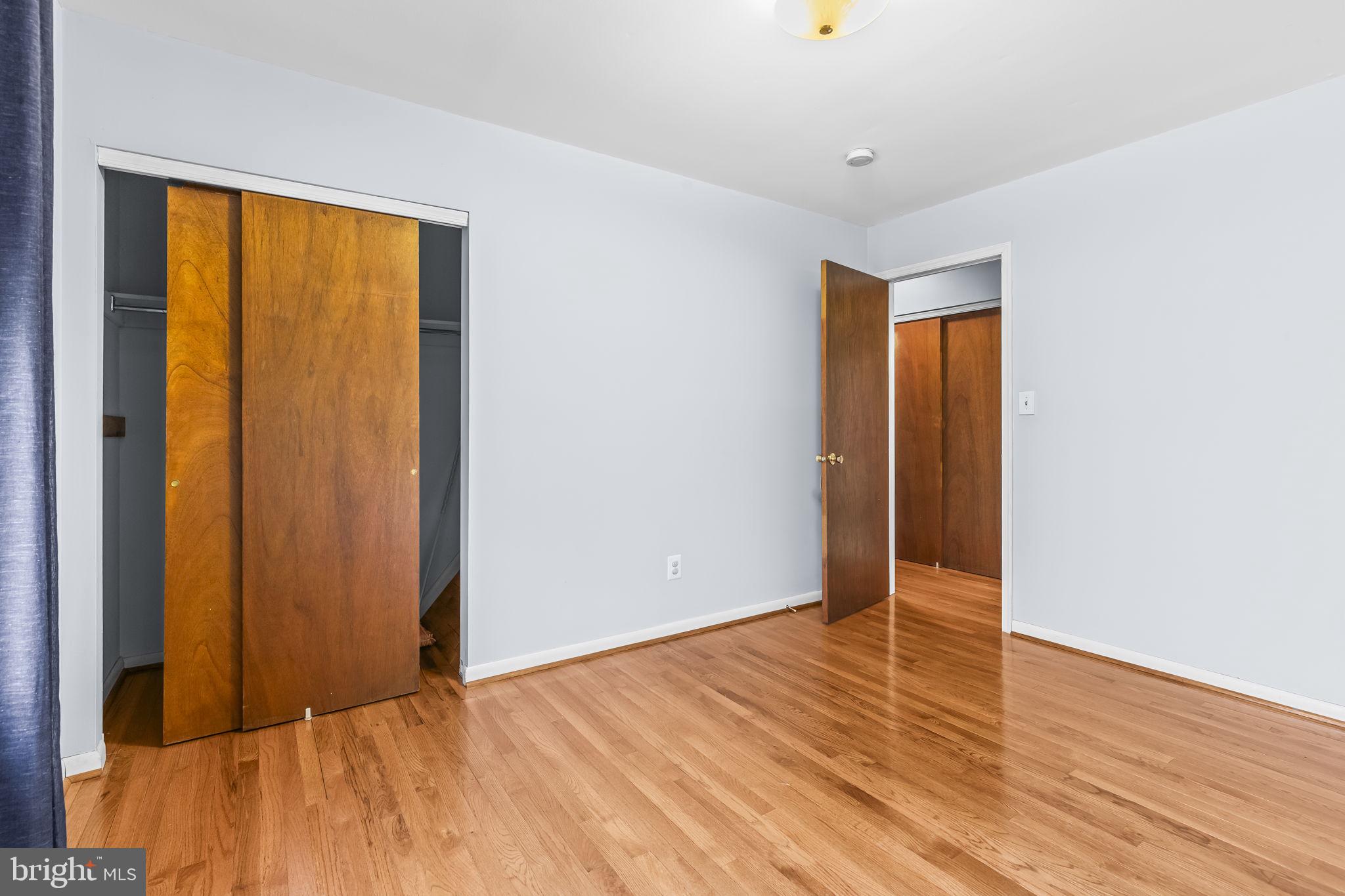 213 King James Road Upper Marlboro, MD 20774 - Photo 21 of 39 a view of an empty room with wooden floor and a window