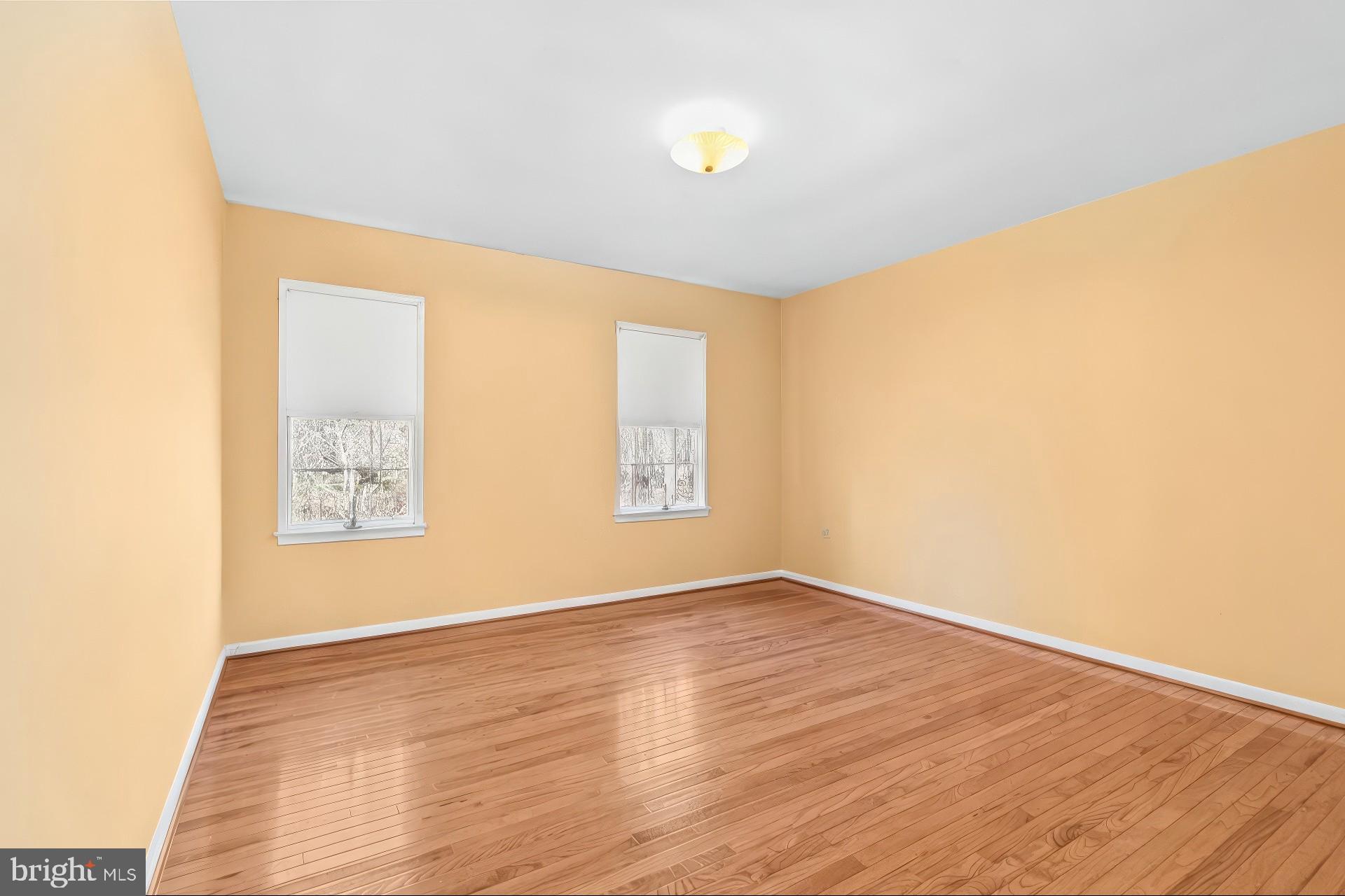 213 King James Road Upper Marlboro, MD 20774 - Photo 23 of 39 a view of an empty room with wooden floor and a window