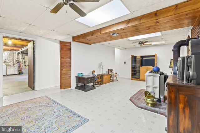 a lobby with furniture and floor to ceiling window