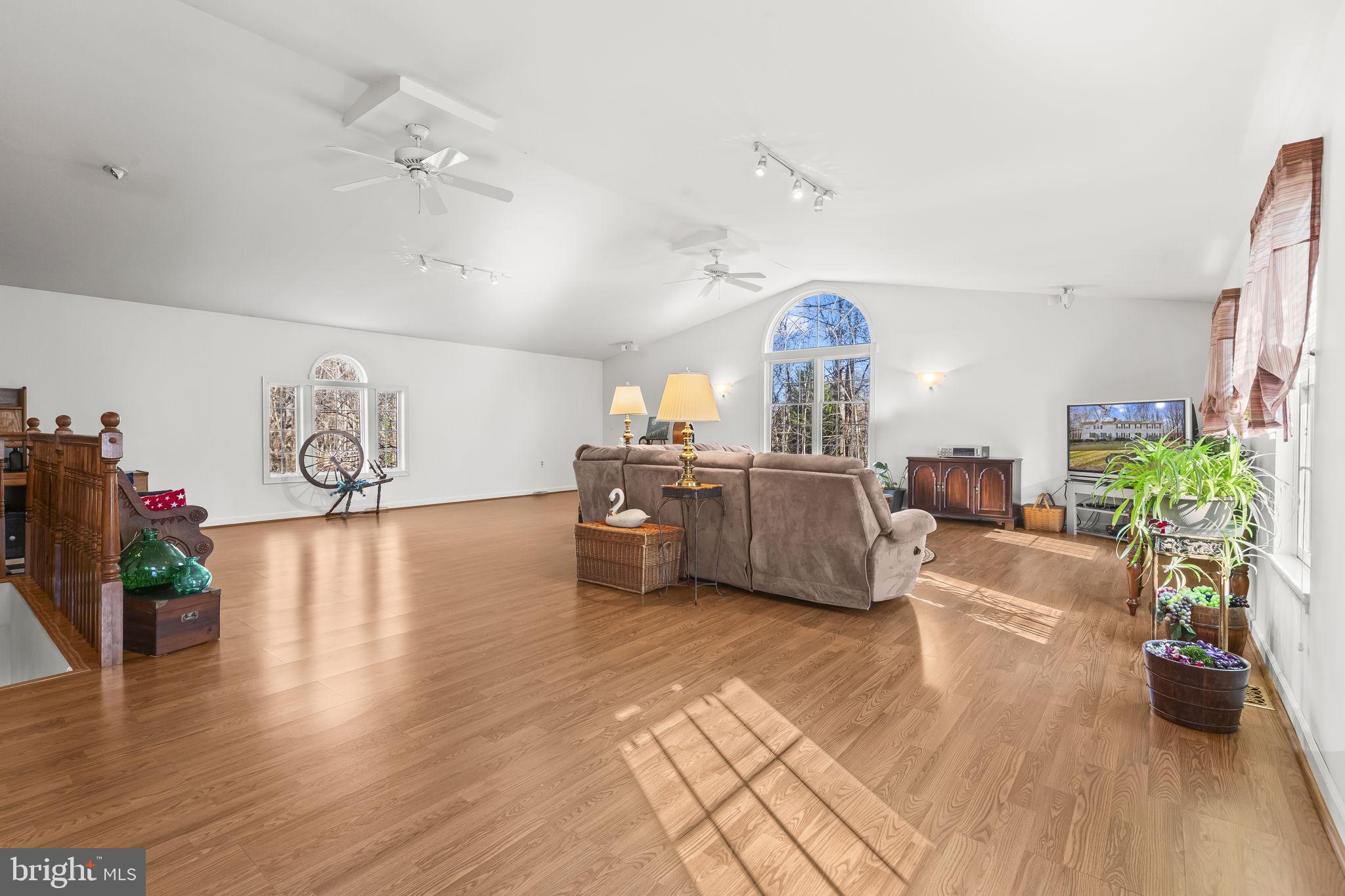 213 King James Road Upper Marlboro, MD 20774 - Photo 3 of 39 a living room with furniture and a chandelier