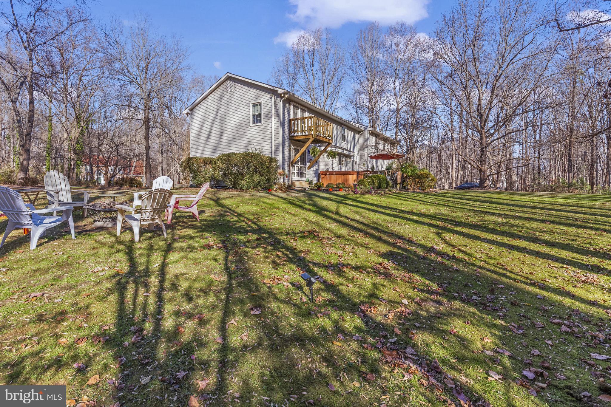 213 King James Road Upper Marlboro, MD 20774 - Photo 35 of 39 a view of a big house with a big yard and large trees