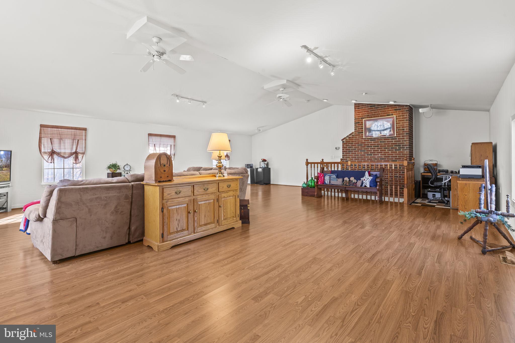 213 King James Road Upper Marlboro, MD 20774 - Photo 4 of 39 a living room with furniture and a wooden floor