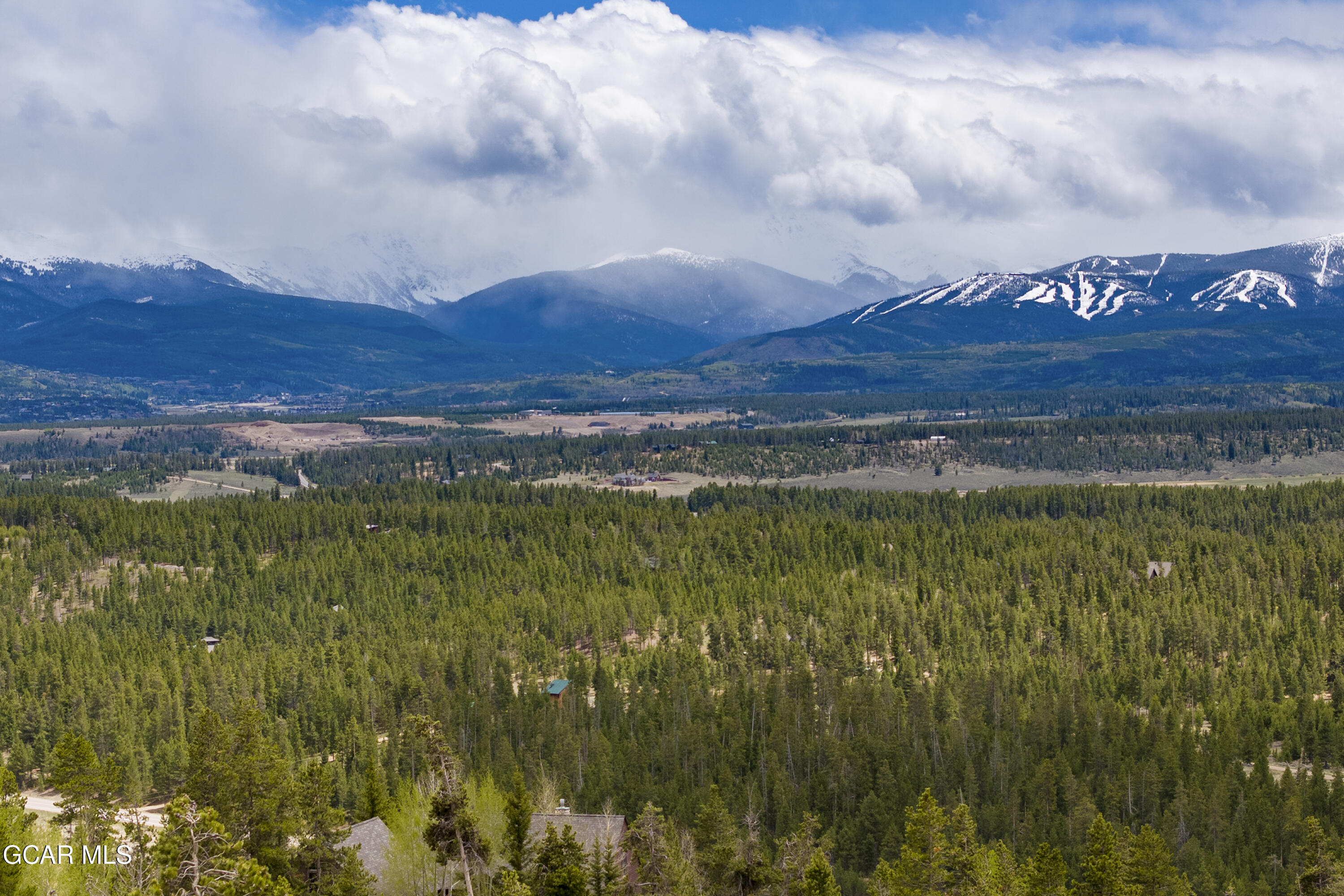 a view of an ocean and mountain