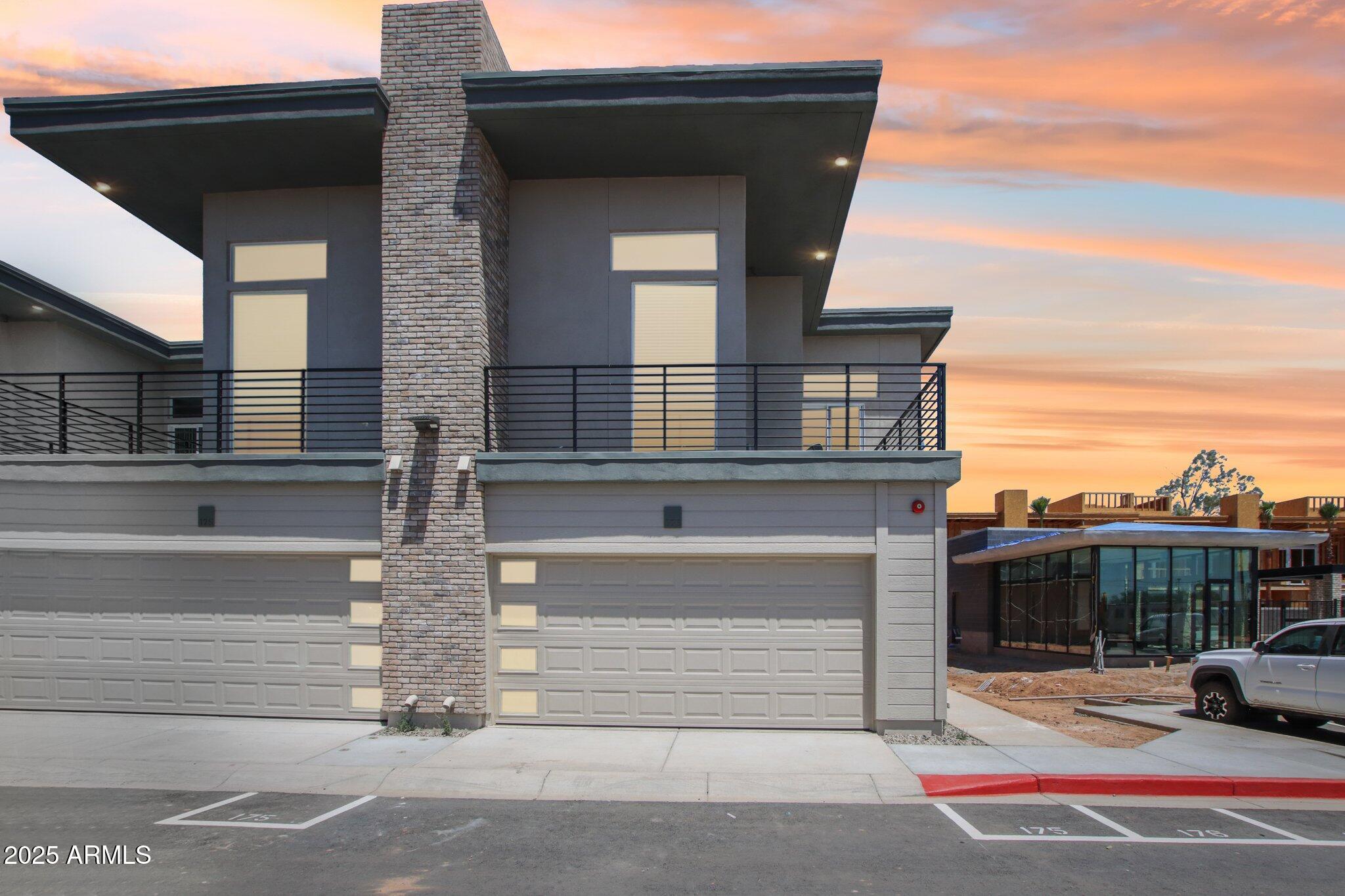 a view of building with car parked