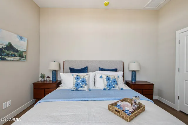 a bedroom with furniture and a wooden floor