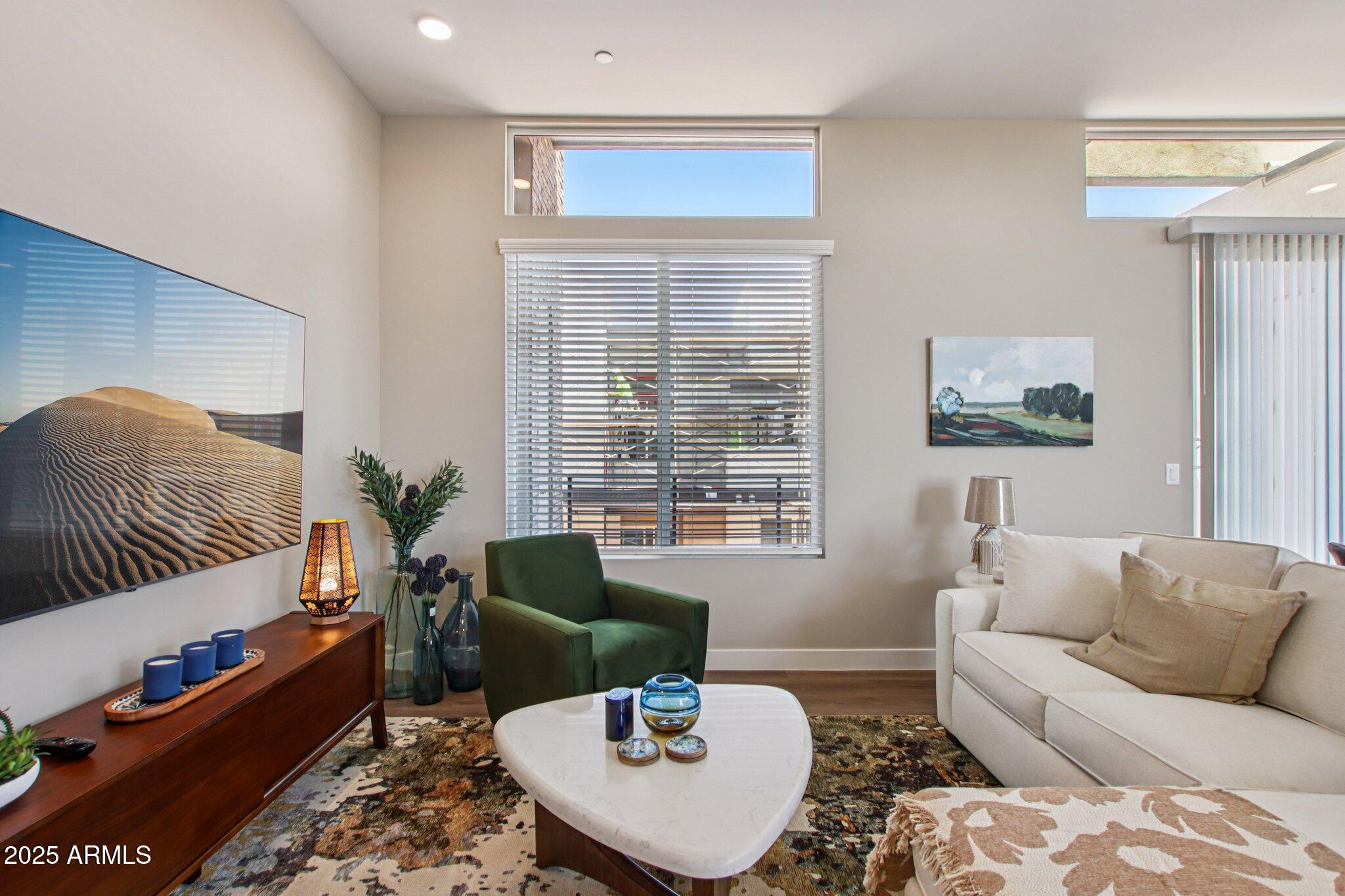 1927 South Recker Road, Unit 175 Mesa, AZ 85206 - Photo 7 of 34 a living room with furniture and a potted plant