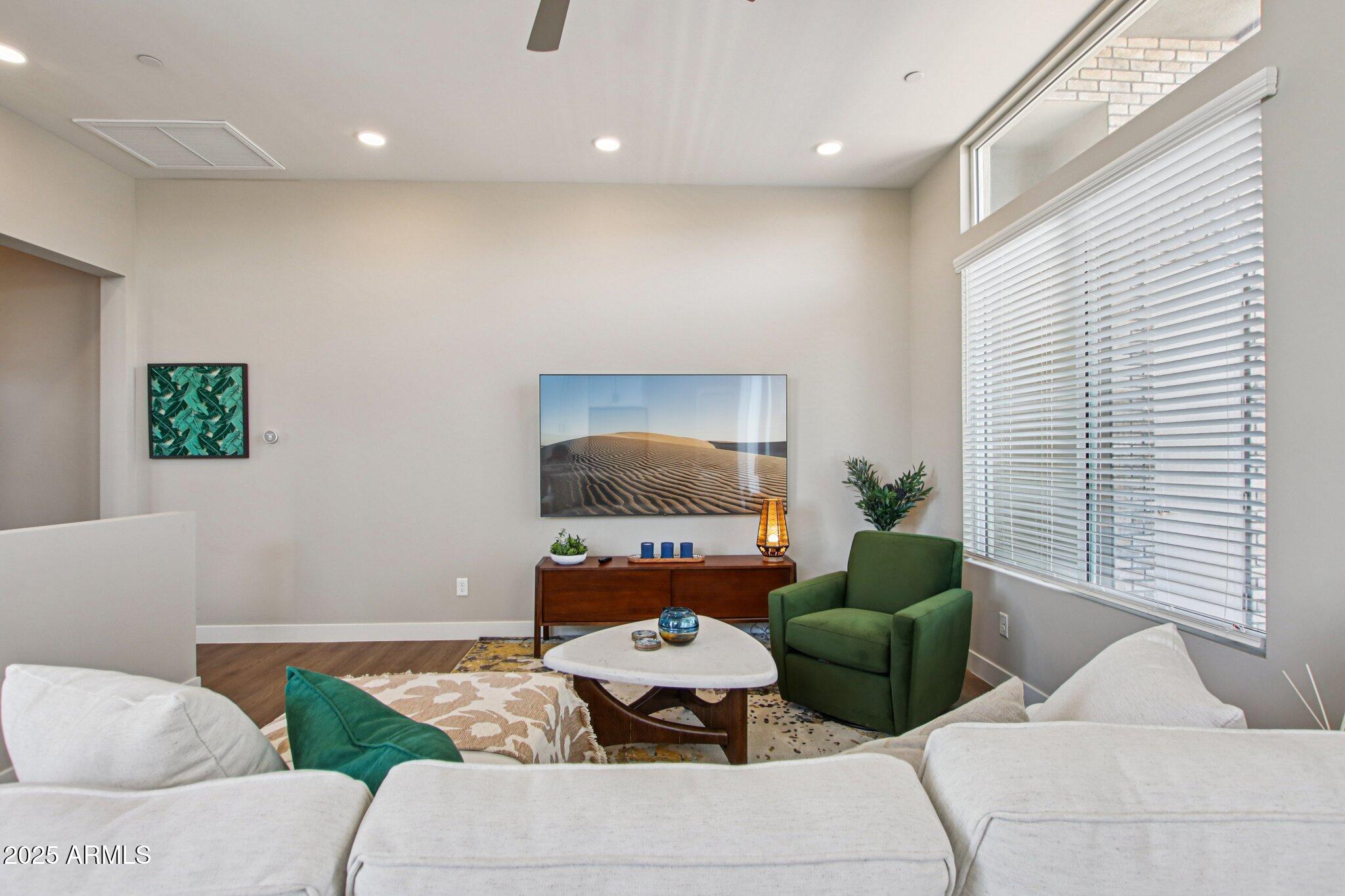 1927 South Recker Road, Unit 175 Mesa, AZ 85206 - Photo 8 of 34 a living room with furniture and a window