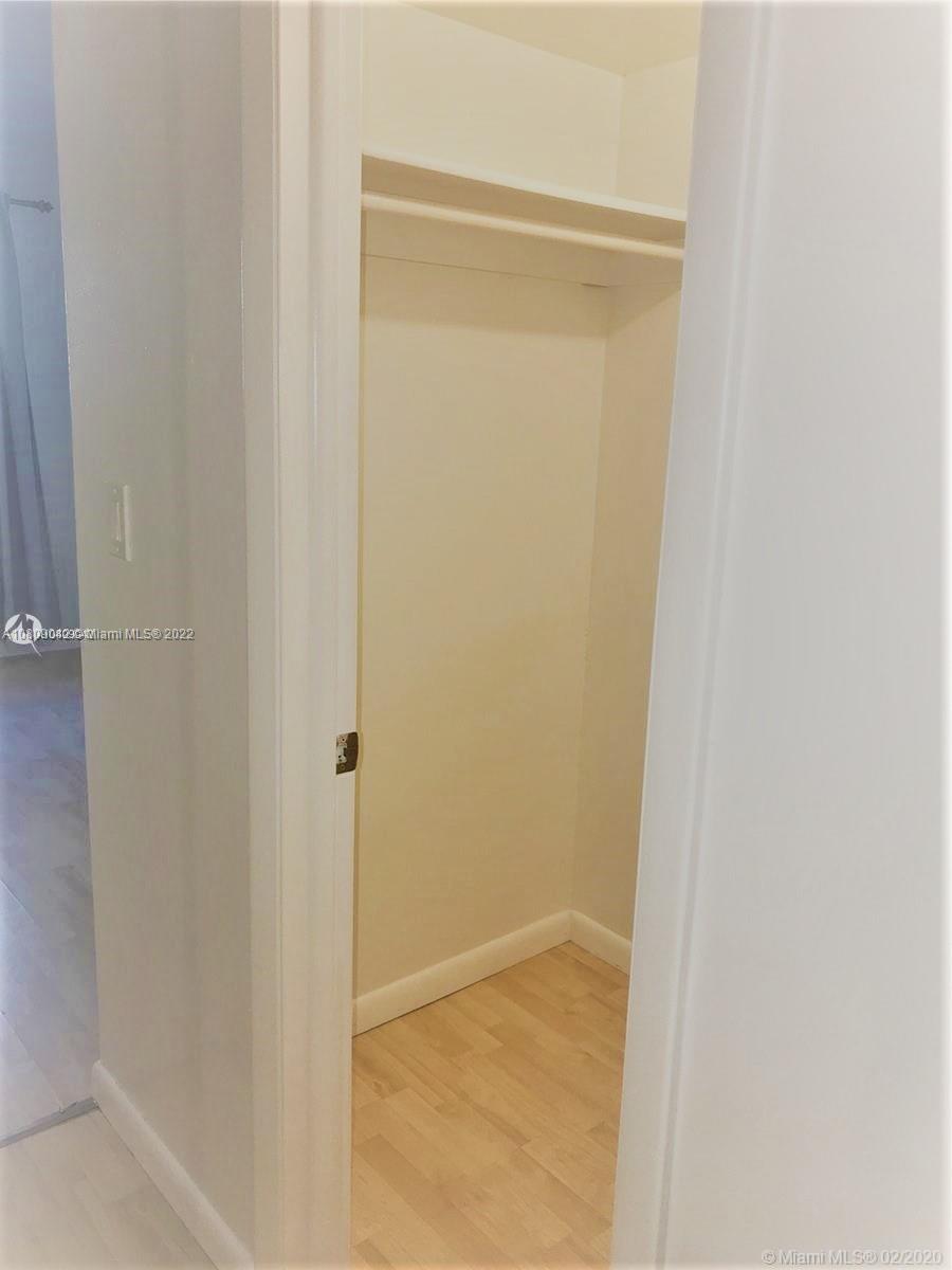 1673 Bay Road, Unit 303 Miami Beach, FL 33139 - Photo 14 of 16 a bathroom with a glass shower door