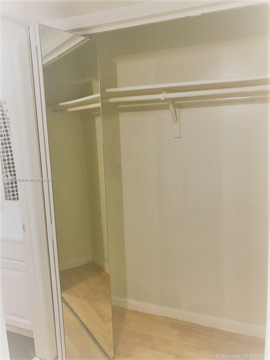 1673 Bay Road, Unit 303 Miami Beach, FL 33139 - Photo 15 of 16 a bathroom with a glass shower door