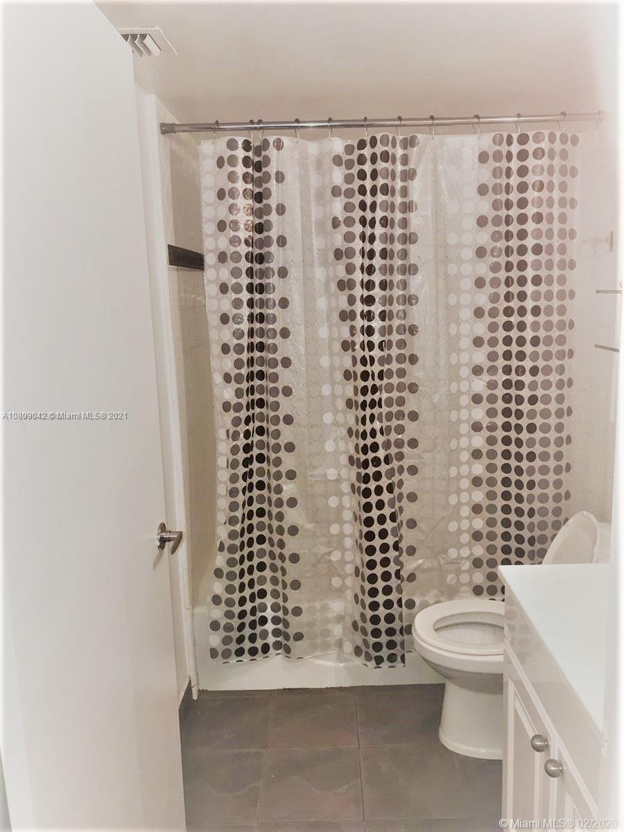 1673 Bay Road, Unit 303 Miami Beach, FL 33139 - Photo 16 of 16 a bathroom with a toilet and a shower