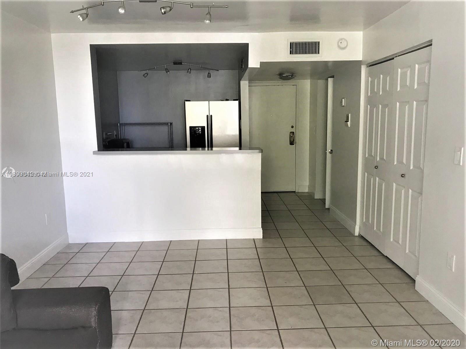 1673 Bay Road, Unit 303 Miami Beach, FL 33139 - Photo 6 of 16 a view of a bathroom with a shower