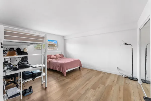 a view of walk in closet with clothes