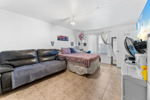 a living room with lots of furniture and a chandelier