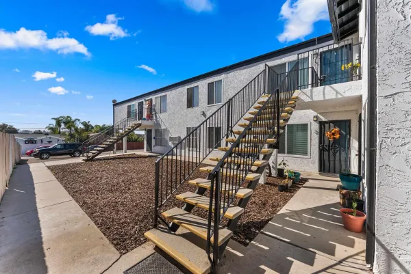 a view of multiple houses with outdoor space