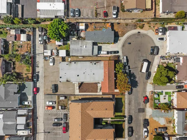 an aerial view of residential houses with outdoor space
