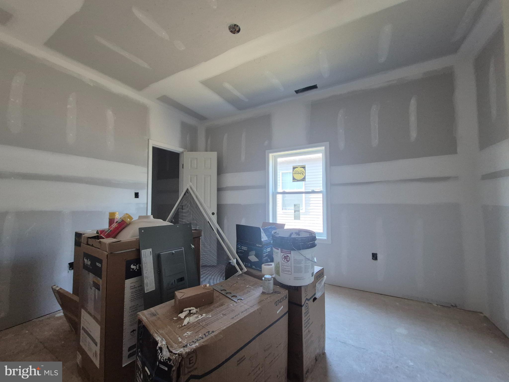 314 Locust Street Crisfield, MD 21817 - Photo 11 of 21 a living room with furniture a window and a wooden floor