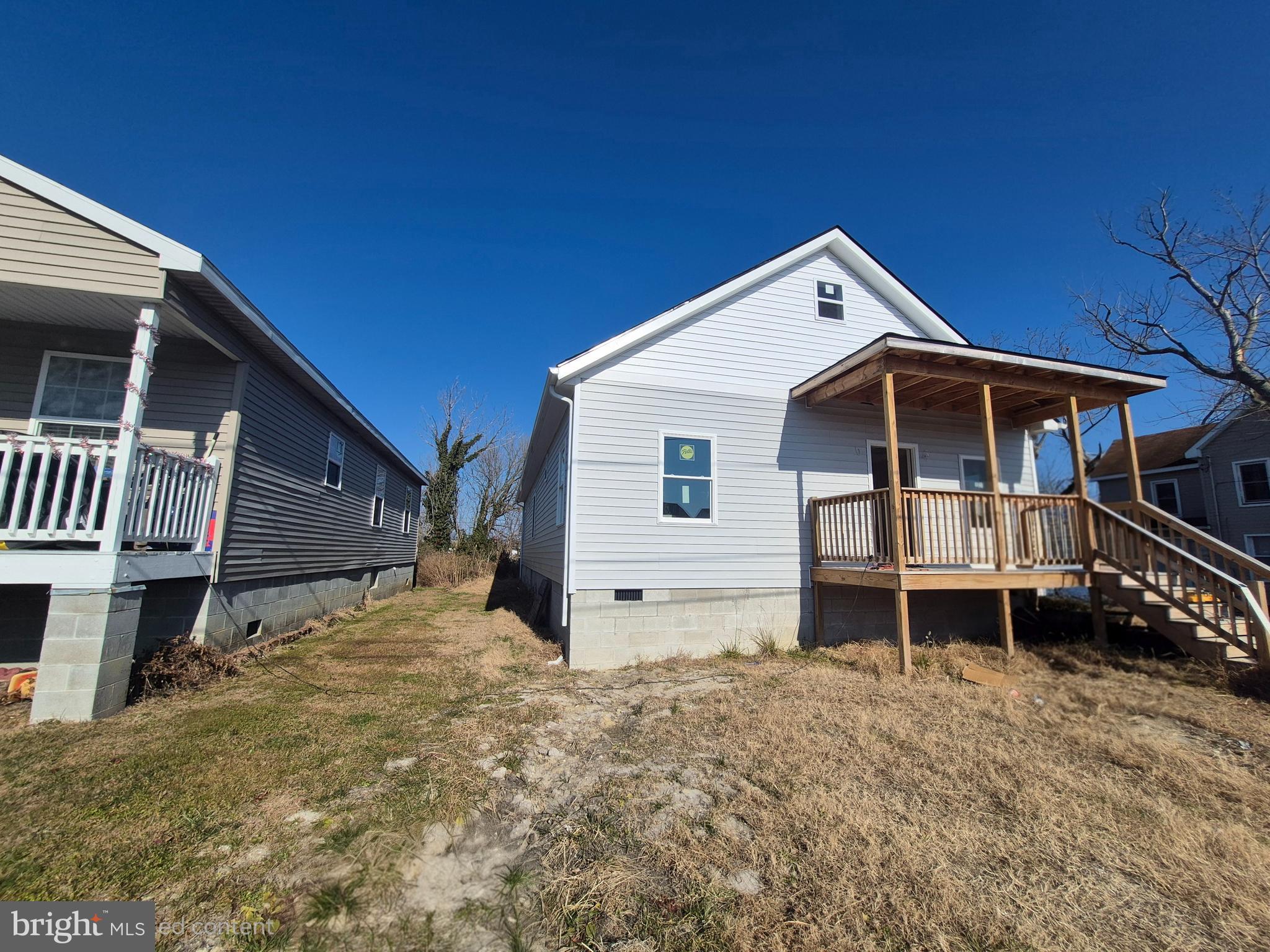 314 Locust Street Crisfield, MD 21817 - Photo 2 of 21 a front view of a house with a yard