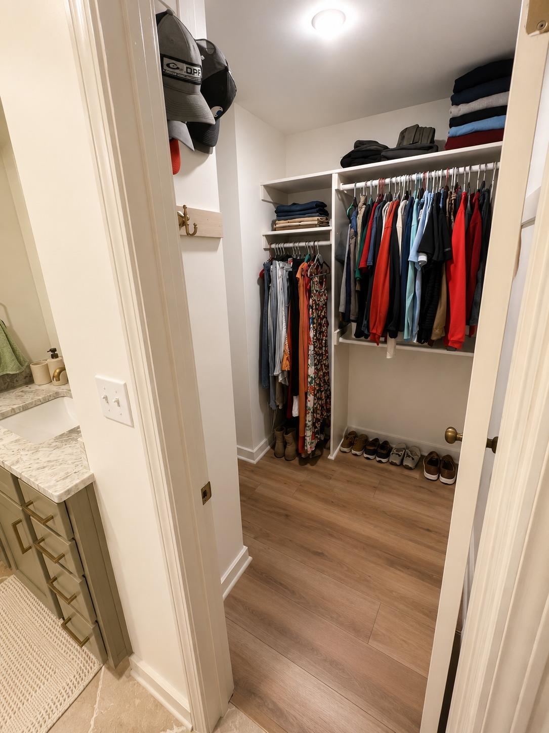 470 Rich Road Somerville, TN 38068 - Photo 30 of 40 Walk-in closet featuring built-in shelving, hanging rods, and wood-finish flooring
