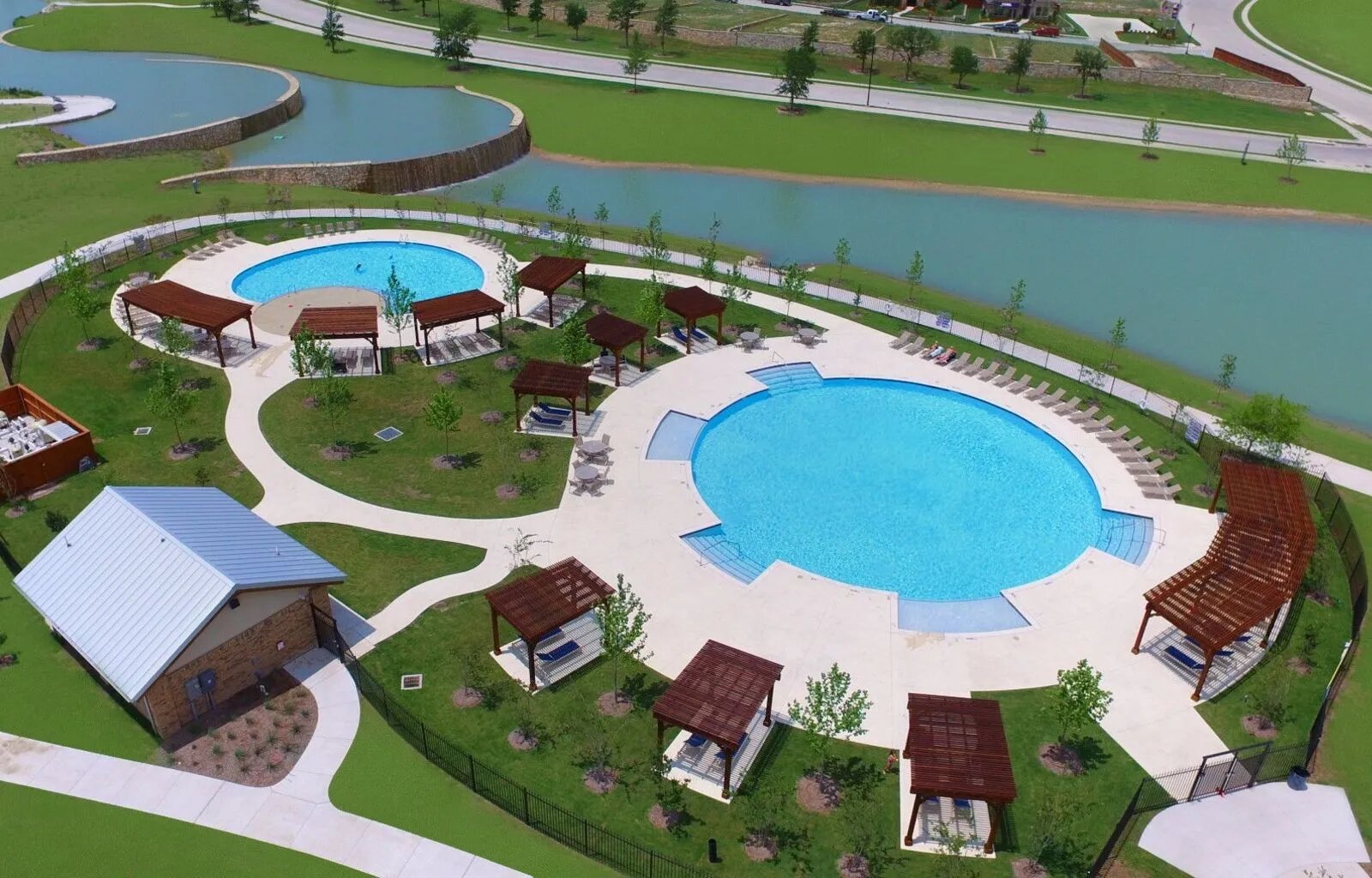 1000 Bright Star Cove Georgetown, TX 78628 - Photo 32 of 40 an aerial view of a swimming pool patio outdoor seating and outdoor kitchen