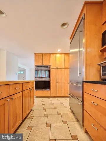 a view of a refrigerator and window