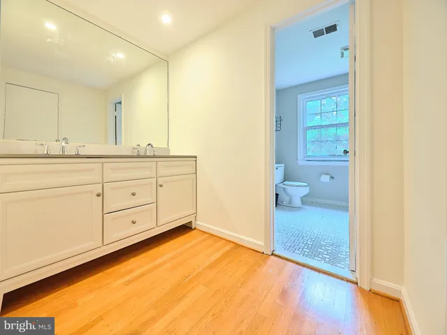 a bathroom with a toilet and a bathtub