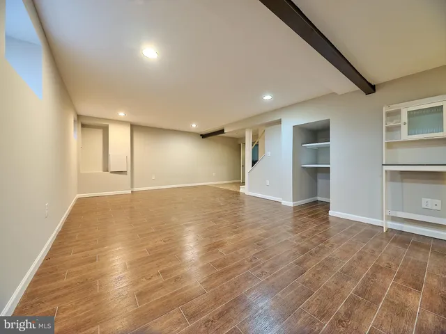a bathroom with a sink toilet a mirror and shower