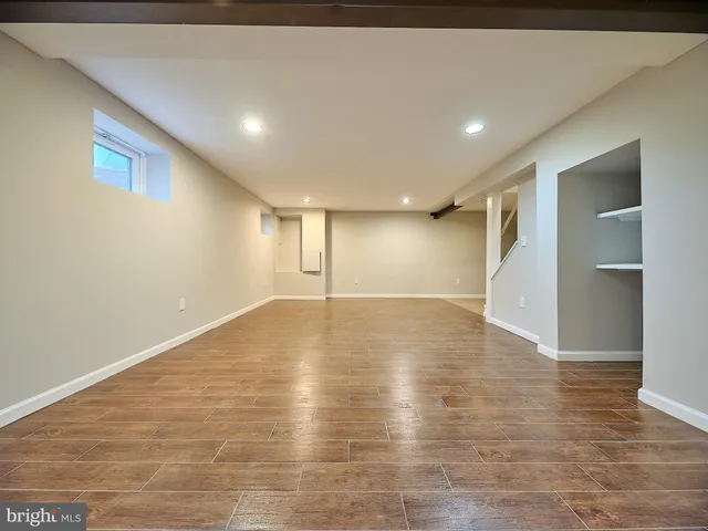 a bathroom with a sink toilet and mirror