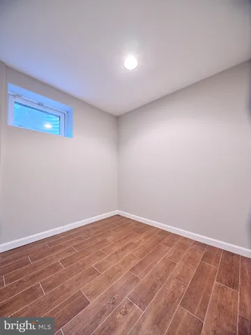 a front view of a house with a garden and plants