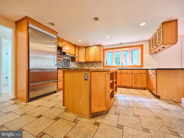 a kitchen with granite countertop a stove and a sink