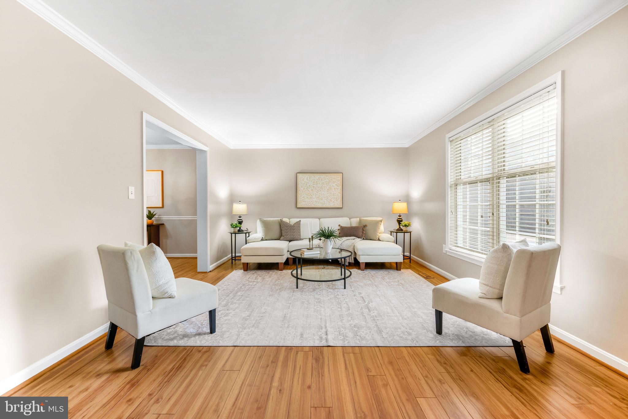 1074 Foxcroft Run Annapolis, MD 21401 - Photo 12 of 66 a living room with furniture and a wooden floor
