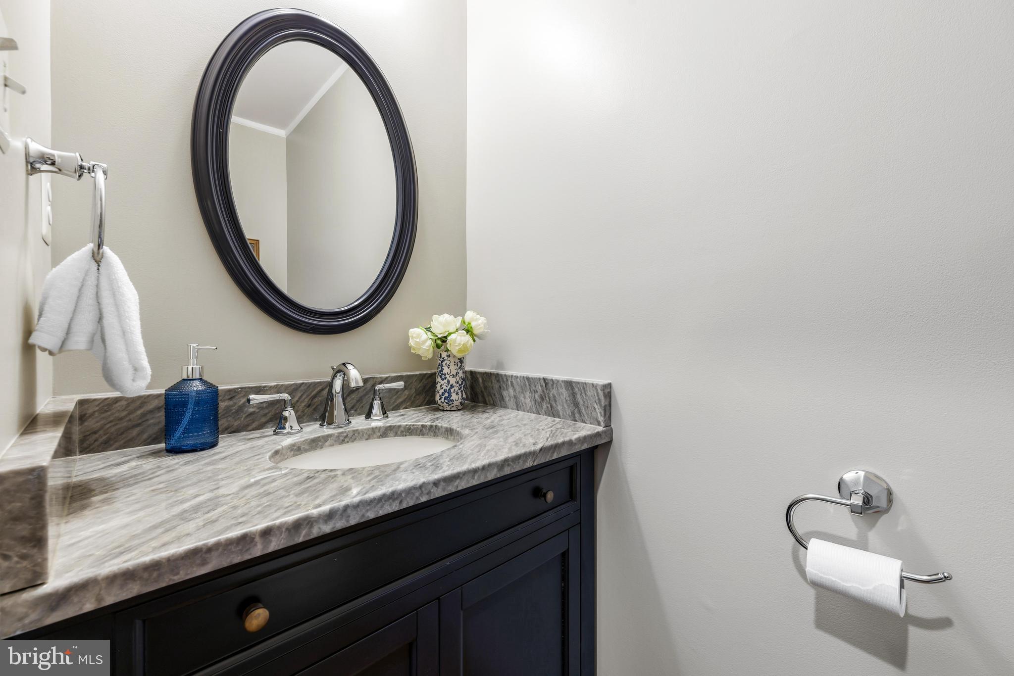 1074 Foxcroft Run Annapolis, MD 21401 - Photo 27 of 66 a bathroom with a granite countertop sink and a mirror